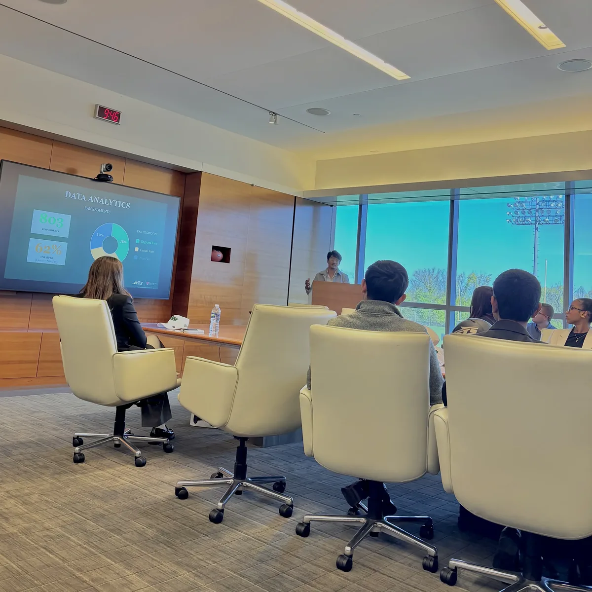 Presenting the fan-segment analysis to the room at the Jets facility.
