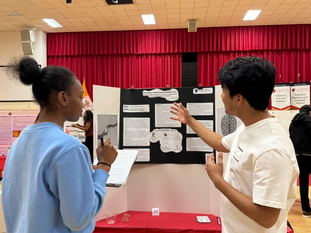 Presenting the thesis poster at the Caldwell University research symposium.